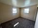 Cozy carpeted bedroom with lots of natural light at 9169 Hibben Ave, Indianapolis, IN 46229
