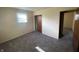 Comfortable carpeted bedroom featuring a window letting in natural light and a closet for storage at 9169 Hibben Ave, Indianapolis, IN 46229
