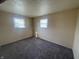 Standard bedroom featuring plush carpet and two windows providing ample natural light at 9169 Hibben Ave, Indianapolis, IN 46229
