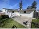 Home exterior featuring a concrete patio and well-maintained vinyl siding at 9169 Hibben Ave, Indianapolis, IN 46229