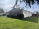 Charming single-story home with stone facade, attached garage, and well-maintained lawn at 9169 Hibben Ave, Indianapolis, IN 46229