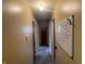 Hallway featuring carpet and a whiteboard with useful notes at 9169 Hibben Ave, Indianapolis, IN 46229