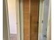Hallway with wooden closet doors, offering practical storage solutions at 9169 Hibben Ave, Indianapolis, IN 46229