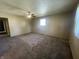 Spacious carpeted living room with natural light at 9169 Hibben Ave, Indianapolis, IN 46229