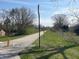 Picturesque walking path through a lush green space with mature trees at 9169 Hibben Ave, Indianapolis, IN 46229