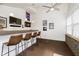 Bar area with seating, decorative lighting, and sports-themed decor for entertaining guests at 9270 N Temple Ave, Indianapolis, IN 46240