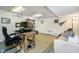 Basement home office features a desk and a place to relax at 9270 N Temple Ave, Indianapolis, IN 46240