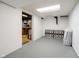 Spacious basement featuring a white cinder block wall, grey floor, and utility access at 9270 N Temple Ave, Indianapolis, IN 46240