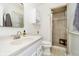 Bright bathroom featuring a walk-in shower with glass door, single sink vanity, and updated fixtures at 9270 N Temple Ave, Indianapolis, IN 46240