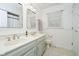 This bright bathroom features double sink vanity and tiled floors at 9270 N Temple Ave, Indianapolis, IN 46240