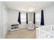 A Bedroom with a crib, plush recliner, and changing table at 9270 N Temple Ave, Indianapolis, IN 46240