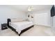 This cozy bedroom features plush carpeting, ceiling fan, and ample closet space for optimal storage at 9270 N Temple Ave, Indianapolis, IN 46240
