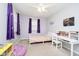 Bright bedroom with a desk, plush carpeting, star-themed lighting, and ample natural light at 9270 N Temple Ave, Indianapolis, IN 46240