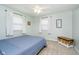A bright bedroom with ample natural light, plush carpet, and decorative chest at 9270 N Temple Ave, Indianapolis, IN 46240