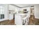 Kitchen with an island, white cabinets, stainless steel appliances, and a view to an outdoor space at 9270 N Temple Ave, Indianapolis, IN 46240