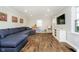 Spacious living room with wood floors, large sectional sofa, and ample natural light at 9270 N Temple Ave, Indianapolis, IN 46240
