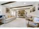 Bright living room with a stone fireplace, built-in shelves, and comfortable seating at 9270 N Temple Ave, Indianapolis, IN 46240