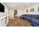 Comfortable living room featuring a large sectional sofa and stylish wood flooring at 9270 N Temple Ave, Indianapolis, IN 46240