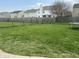 A large backyard with fresh cut grass and chainlink fence at 9873 Blue Ridge Way, Indianapolis, IN 46234
