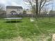 Large backyard with fresh cut grass, chainlink fence, and trampoline at 9873 Blue Ridge Way, Indianapolis, IN 46234