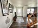 Welcoming entryway with hardwood floors, stylish decor, and access to the staircase at 9873 Blue Ridge Way, Indianapolis, IN 46234
