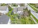 Aerial view of home with green lawn, landscaping, trees, and covered patio at 10471 Meadow Lake Dr, Fishers, IN 46038