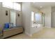 Luxurious bathroom featuring a soaking tub, separate shower, and elegant decor at 10471 Meadow Lake Dr, Fishers, IN 46038