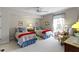Charming bedroom with two twin beds, soft lighting, and a cozy armchair by the window at 10471 Meadow Lake Dr, Fishers, IN 46038