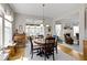 Dining room with hardwood floors next to a living room with a fireplace and nice decor at 10471 Meadow Lake Dr, Fishers, IN 46038