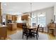 Charming dining room next to kitchen with a wooden table, decorative chandelier and hardwood floors at 10471 Meadow Lake Dr, Fishers, IN 46038