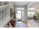 Elegant foyer with hardwood floors, staircase, and a view into the dining room at 10471 Meadow Lake Dr, Fishers, IN 46038