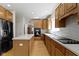 Spacious kitchen with stainless steel refrigerator, hardwood floors, and center island at 10471 Meadow Lake Dr, Fishers, IN 46038
