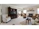 Inviting living room with a large TV, fireplace, and access to other rooms at 10471 Meadow Lake Dr, Fishers, IN 46038