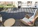 Comfortable balcony with cozy chairs and outdoor seating overlooking the parking lot at 1053 Reserve Way, Indianapolis, IN 46220
