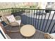 Relaxing balcony with wicker furniture and views of the parking area at 1053 Reserve Way, Indianapolis, IN 46220