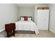 Bedroom with concrete walls, flooring, storage and a place to kick back and relax at 1053 Reserve Way, Indianapolis, IN 46220