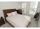 Cozy bedroom with natural light, a full-length mirror, and modern furniture at 1053 Reserve Way, Indianapolis, IN 46220