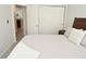 Comfortable bedroom with soft lighting, and a convenient closet with folding doors at 1053 Reserve Way, Indianapolis, IN 46220
