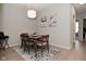 Dining room with hardwood floors, modern table and chairs, and decorative artwork at 1053 Reserve Way, Indianapolis, IN 46220