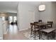Cozy dining area with wooden table, stylish chairs, and views of the living room at 1053 Reserve Way, Indianapolis, IN 46220