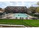 Community pool offering a refreshing oasis surrounded by beautiful buildings and meticulous landscaping at 1053 Reserve Way, Indianapolis, IN 46220