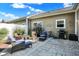 Cozy back patio with stone pavers offers an inviting outdoor seating area and grill, perfect for entertaining at 10955 Chapel Woods N Blvd, Noblesville, IN 46060