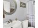 Well-lit bathroom featuring modern fixtures, decorative mirror, and inspiring wall art for a relaxing atmosphere at 10955 Chapel Woods N Blvd, Noblesville, IN 46060