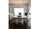 A bright dining room with hardwood floors and modern chandelier at 10955 Chapel Woods N Blvd, Noblesville, IN 46060