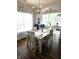 Bright dining room area open to a living space with hardwood floors at 10955 Chapel Woods N Blvd, Noblesville, IN 46060