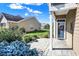 Charming front entryway features a covered porch, a welcoming front door, and landscaped garden beds at 10955 Chapel Woods N Blvd, Noblesville, IN 46060