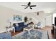 Cozy living room with a ceiling fan, plush seating, and hardwood floors at 10955 Chapel Woods N Blvd, Noblesville, IN 46060