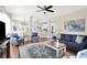 Spacious living room featuring hardwood floors and open access to the kitchen at 10955 Chapel Woods N Blvd, Noblesville, IN 46060