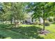 Lush garden along the side of the home features various plants and landscaping elements, adding charm to the exterior at 10955 Chapel Woods N Blvd, Noblesville, IN 46060