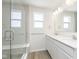 Modern bathroom featuring double vanity, glass shower, and light fixtures at 10965 Morab Dr, Zionsville, IN 46077